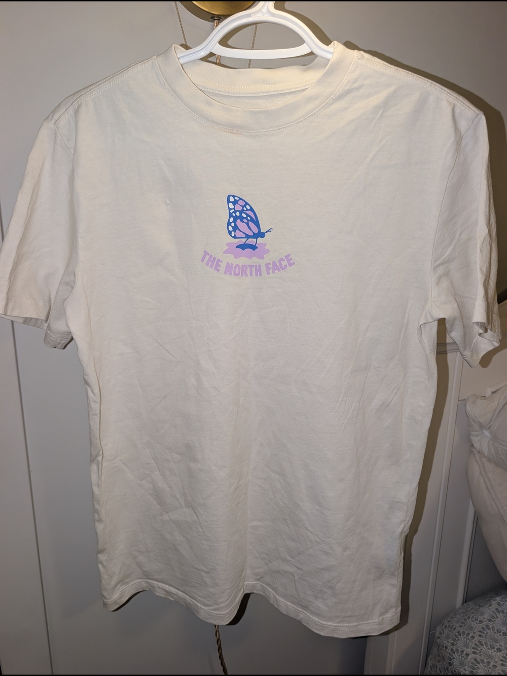 The North Face White Tee with Pastel Butterfly Graphic